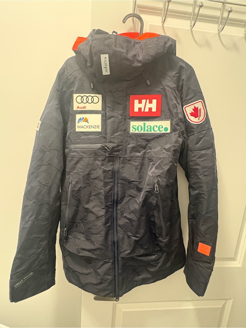 Helly Hansen Canada ski team Navy Jacket with Orange Accents and Logo Patches